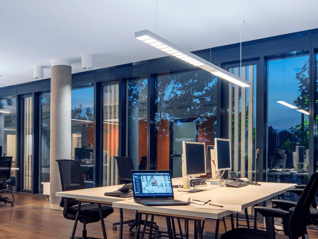 Why Your Commercial Building's Lighting Schedule Is Making Everyone Tired Office interior with dynamic lighting