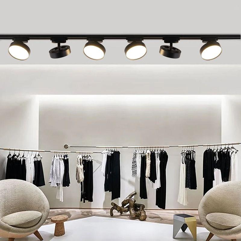 Retail Store Fixture Lighting in 2026: Why Your Shop Looks Wrong Modern retail space with black track lighting fixtures