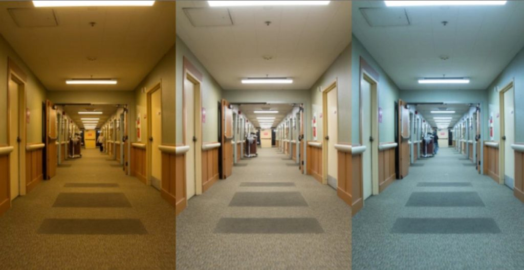 Three side-by-side views of the same care home corridor under different lighting temperatures: warm yellow on the left creating a cozy atmosphere, neutral white in the middle, and cool blue on the right creating a clinical institutional feel