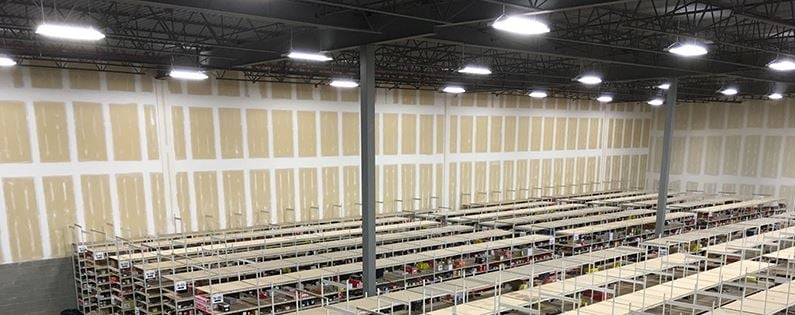 LED Fixture Sourcing: When Component Procurement Makes Sense (and When It Doesn't) Commercial warehouse LED high bay lighting installation